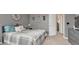 Comfortable bedroom featuring a gray color scheme, bed, and stylish decorations at 16184 Gold Creek Dr, Monument, CO 80132