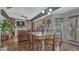 Charming dining area with fireplace, hardwood floors, and an abundance of natural light at 16184 Gold Creek Dr, Monument, CO 80132