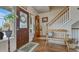Inviting entryway featuring hardwood floors, a bench, and a staircase at 16184 Gold Creek Dr, Monument, CO 80132