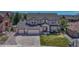 Charming two-story home with a three car garage and well-manicured lawn on a sunny day at 16184 Gold Creek Dr, Monument, CO 80132