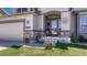 Inviting front porch with decorative details and a charming entrance to the home, with stone accents at 16184 Gold Creek Dr, Monument, CO 80132