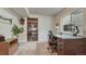 Functional home office with built-in bookshelf and ample desk space at 16184 Gold Creek Dr, Monument, CO 80132