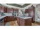 Modern kitchen featuring stainless steel appliances, granite counters, and a center island cooktop at 16184 Gold Creek Dr, Monument, CO 80132