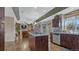 Spacious kitchen and living area with granite counters, wood cabinets, and stainless appliances at 16184 Gold Creek Dr, Monument, CO 80132