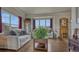 Bright and airy living room featuring hardwood floors and large windows at 16184 Gold Creek Dr, Monument, CO 80132