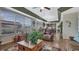 Spacious living room view with hardwood floors, large windows, and comfortable seating at 16184 Gold Creek Dr, Monument, CO 80132