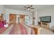 Spacious bedroom with wood sliding doors and a ceiling fan at 16184 Gold Creek Dr, Monument, CO 80132