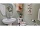 Well-maintained powder room with a pedestal sink and modern fixtures at 16184 Gold Creek Dr, Monument, CO 80132