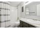 Full bathroom with tub, shower, and grey vanity at 9044 W 63Rd Ave, Arvada, CO 80004