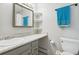 Bathroom with vanity, shelves and toilet at 9044 W 63Rd Ave, Arvada, CO 80004