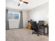 Bedroom with ceiling fan, window, and workspace at 9044 W 63Rd Ave, Arvada, CO 80004