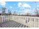 Spacious deck with string lights overlooks a tree-lined landscape at 9044 W 63Rd Ave, Arvada, CO 80004