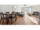 Dining area with hardwood floors and kitchen access at 9044 W 63Rd Ave, Arvada, CO 80004