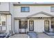 Front view of townhome with walkway and landscaping at 9044 W 63Rd Ave, Arvada, CO 80004