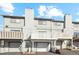 Townhouse exterior featuring a two-car garage and private deck at 9044 W 63Rd Ave, Arvada, CO 80004