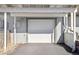 Attached one car garage with automatic overhead door, an exterior utility connection, and driveway at 9044 W 63Rd Ave, Arvada, CO 80004