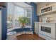 Bright kitchen features white appliances and a bay window at 9044 W 63Rd Ave, Arvada, CO 80004