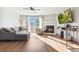Bright living room, fireplace, and deck access at 9044 W 63Rd Ave, Arvada, CO 80004