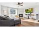 Living room with fireplace, deck access, and hardwood floors at 9044 W 63Rd Ave, Arvada, CO 80004