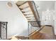 Modern staircase with wood and metal accents at 9044 W 63Rd Ave, Arvada, CO 80004