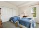 Bright bedroom featuring two twin beds, soft lighting and ample closet space at 335 Josephine St # D, Denver, CO 80206