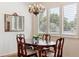 Cozy dining room with wood table set and chandelier at 335 Josephine St # D, Denver, CO 80206