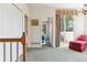 Upstairs hallway with balcony door, with glimpses of a bedroom and living room at 335 Josephine St # D, Denver, CO 80206