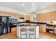 Modern kitchen features a breakfast bar with granite counters and stainless steel appliances at 335 Josephine St # D, Denver, CO 80206