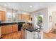 Bright kitchen with granite countertops, wooden cabinets, and access to a lovely patio at 335 Josephine St # D, Denver, CO 80206