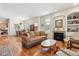 Spacious living room features a cozy fireplace, hardwood floors, and seamlessly connects to the dining area at 335 Josephine St # D, Denver, CO 80206