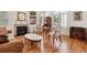 Elegant living room with fireplace, beautiful wood floors, and cozy seating at 335 Josephine St # D, Denver, CO 80206