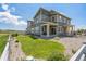 Large backyard with green grass, landscaped area and fenced perimeter at 1842 Peak Prairie Ln, Monument, CO 80132