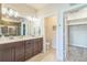 Bathroom features double sink vanity, walk in closet and separate toilet room at 1842 Peak Prairie Ln, Monument, CO 80132