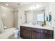 Bathroom features a tub, vanity and mirror at 1842 Peak Prairie Ln, Monument, CO 80132