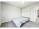 Modern bedroom with a pull-down bed, gray carpet, and contemporary style at 1842 Peak Prairie Ln, Monument, CO 80132