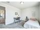 Bright bedroom with desk, chair, and single bed at 1842 Peak Prairie Ln, Monument, CO 80132