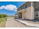 Exterior view of home with stone accents, porch and landscaped yard at 1842 Peak Prairie Ln, Monument, CO 80132