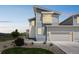 Inviting two-story home with a stone accent and manicured landscaping enhances curb appeal at 1842 Peak Prairie Ln, Monument, CO 80132