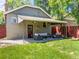 Charming backyard patio with comfortable seating under a covered area, blending indoor comfort with outdoor serenity at 4250 Wyandot St, Denver, CO 80211