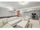 Spacious finished basement with a lounge area, office, and a unique brick pillar at 4250 Wyandot St, Denver, CO 80211