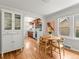Charming dining area with hardwood floors adjacent to the kitchen, perfect for entertaining at 4250 Wyandot St, Denver, CO 80211