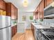 Well-lit kitchen with stainless steel appliances, quartz countertops, and modern backsplash at 4250 Wyandot St, Denver, CO 80211