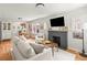 Bright living room features a decorative fireplace, large windows, and an open layout at 4250 Wyandot St, Denver, CO 80211