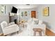 Comfortable living room with hardwood floors, a fireplace, and abundant natural light at 4250 Wyandot St, Denver, CO 80211