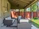 Covered patio with comfortable seating, string lights, fan and charming outdoor space perfect for relaxation at 4250 Wyandot St, Denver, CO 80211