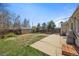 Spacious backyard with a concrete patio, detached garage and a well-maintained lawn at 3492 S Elm St, Denver, CO 80222