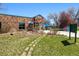 Exterior of a brick building with a peaked entrance and pool area in the back at 3492 S Elm St, Denver, CO 80222
