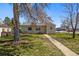 Charming single-story home featuring a well-maintained lawn and mature trees in a suburban setting at 3492 S Elm St, Denver, CO 80222