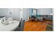 Inviting living area featuring hardwood floors, a comfortable sofa, and an open layout at 3492 S Elm St, Denver, CO 80222