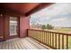 The balcony features a wooden deck, railing, and a view at 2552 W 82Nd Ln # C, Westminster, CO 80031